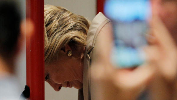 Hillary Clinton fills out her ballot at the Douglas Grafflin Elementary School in Chappaqua, New York. REUTERS/Brian Snyder